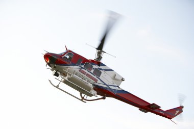 Low angle view of Medevac helicopter in flight clipart