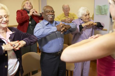Senior adults in a stretching class clipart