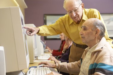 Senior men using computer clipart