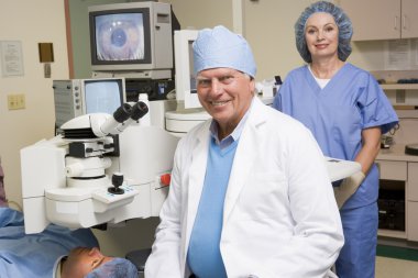 Doctor, Nurse And Patient About To Undergo Eye Exam clipart