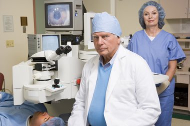 Doctor, Nurse And Patient About To Undergo Eye Exam clipart