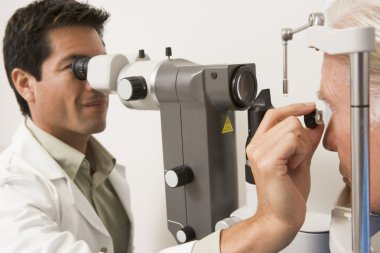 Doctor Checking Patient's Eyes clipart