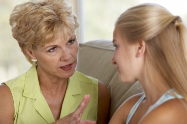 Woman Having A Serious Talk With Her Daughter clipart