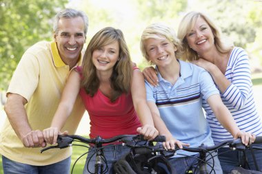 Family Cycling Through A Park clipart