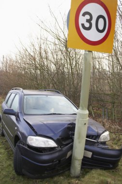 Car Wrapped Around Speed Limit Sign clipart