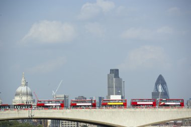 Double Decker Buses Lined Up On A Bridge With St Paul's Cathedra clipart