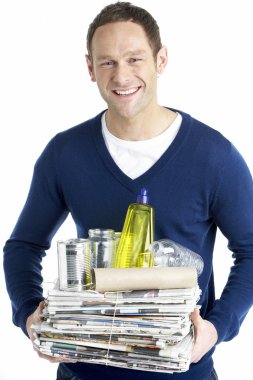 Man Carrying Stack Of Recycling clipart