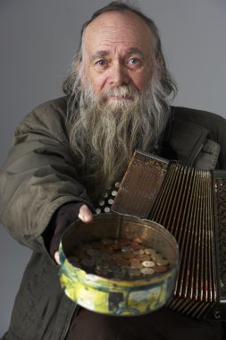 Senior Man Busking With Accordian clipart