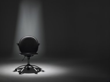 Empty Office Chair In Spotlight clipart