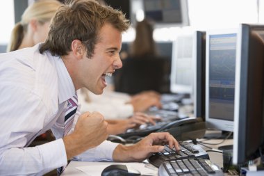 Stock Trader Overjoyed Looking At Monitor clipart