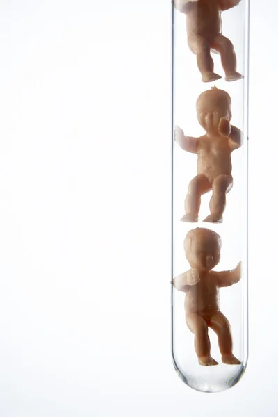 Figuras de bebé en tubos de ensayo —  Fotos de Stock