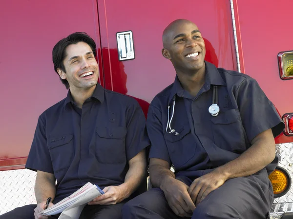 Two Paramedics Cheerfully Doing Paperwork Sitting Ambu — Stock Photo, Image