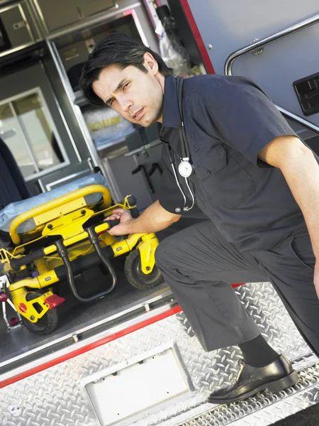 Paramedic Removing Empty Gurney Ambulance — Stock Photo, Image