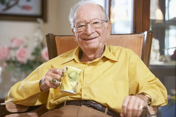 Senior Man Drinking Hot Beverage — Stock Photo, Image