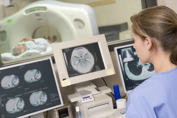 Nurse Monitoring Patient Having Computerized Axial Tomography Cat Scan — Stock Photo, Image