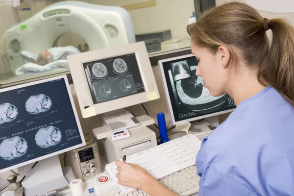 Nurse Monitoring Patient Having Computerized Axial Tomography Cat Scan — Stock Photo, Image