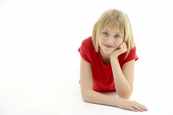 Young Girl Lying On Stomach In Studio — Stock Photo, Image