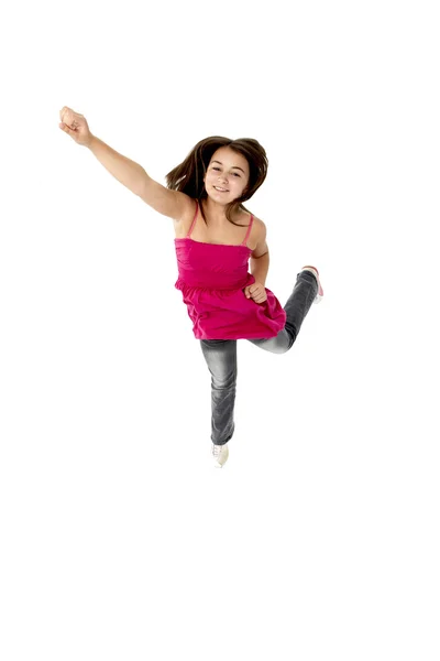Ung flicka hoppade i studio — Stockfoto