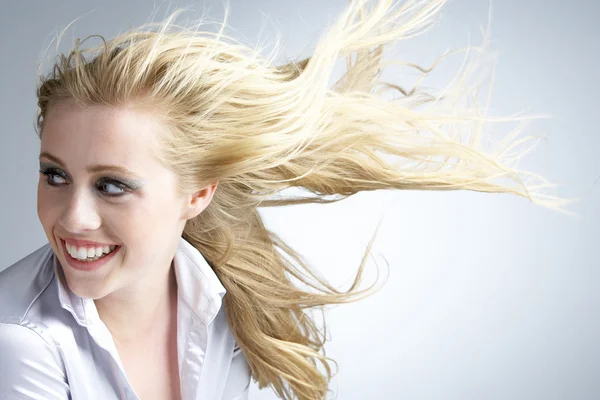 Young Woman With Hair Blowing Behind — Stock Photo, Image