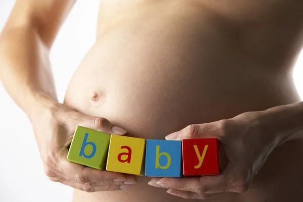 Pregnant Woman Holding Blocks Spelling Baby — Stock Photo, Image