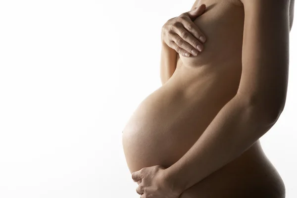 妊娠中の女性の胃を保持の詳細 — ストック写真