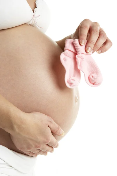 Kobieta Ciąży Przytrzymanie Dziecka Różowe Skarpetki — Zdjęcie stockowe