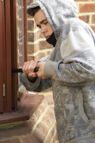 Young Man Breaking Into House — Stock Photo, Image