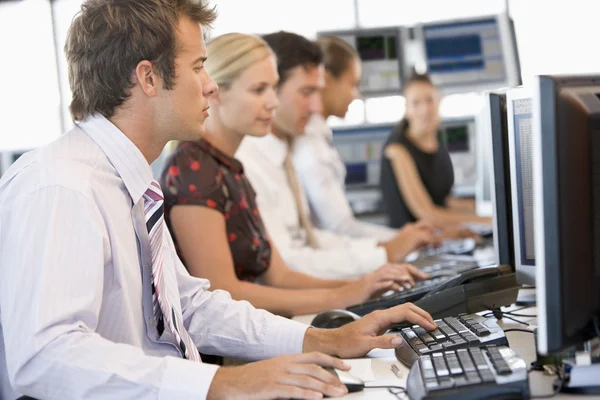 Stock Traders Working At Computers Royalty Free Stock Images