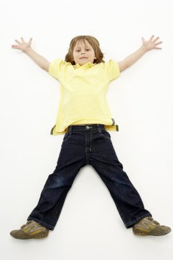Studio Portrait of Smiling Boy lying down with arms and legs spr clipart