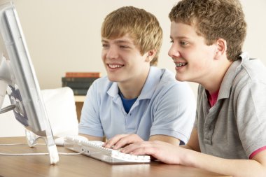 Two Teenage Boys on Computer at Home clipart