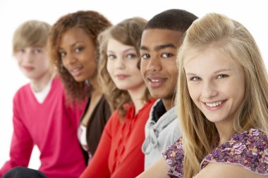 Studio Portrait Of Five Teenage Friends Standing In Line clipart