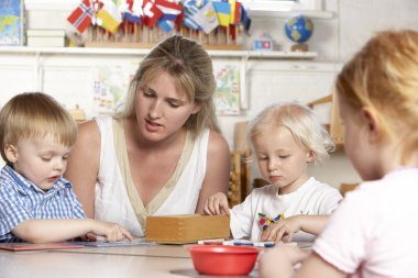 Young Boy Playing at Montessori/Pre-School clipart