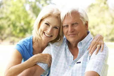 Portrait Of Senior Couple In Park clipart