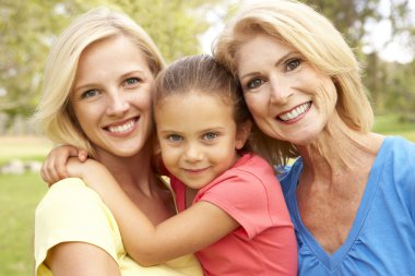 Grandmother With Mother And Daughter In Park clipart