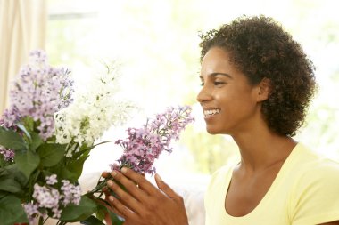 Woman Flower Arranging At Home clipart