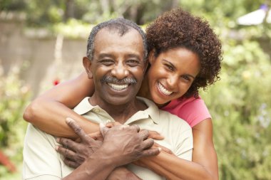 Senior Man Hugging Adult Daughter clipart