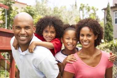 Portrait of Happy Family In Garden clipart