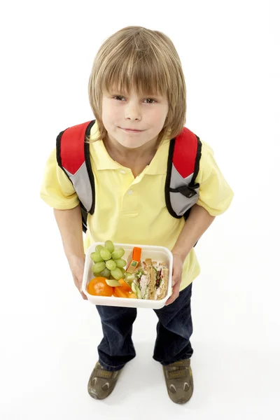 室画像的微笑男孩举行午餐盒 — 图库照片