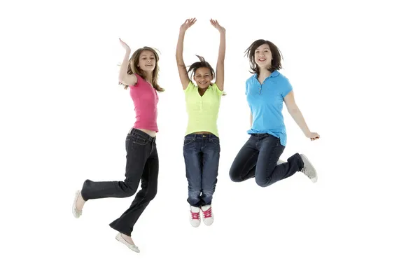 Group of Teenage Girlfriends Jumping in Studio — Stock Photo, Image