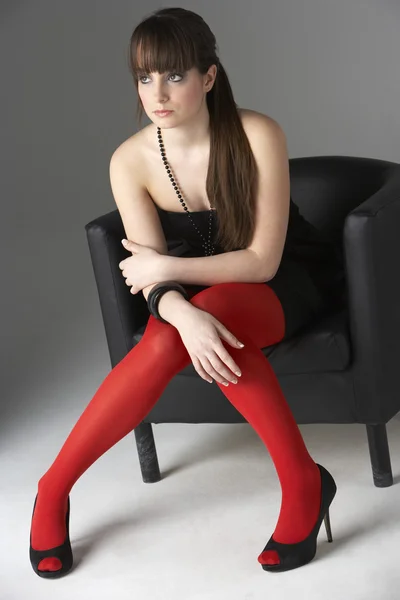 Studio Portrait Fashionably Dressed Teenage Girl Sitting — Stock Photo, Image
