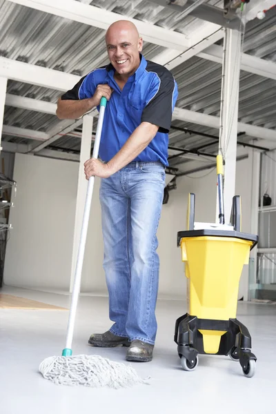 Cleaner mopping office floor — Stock Photo, Image
