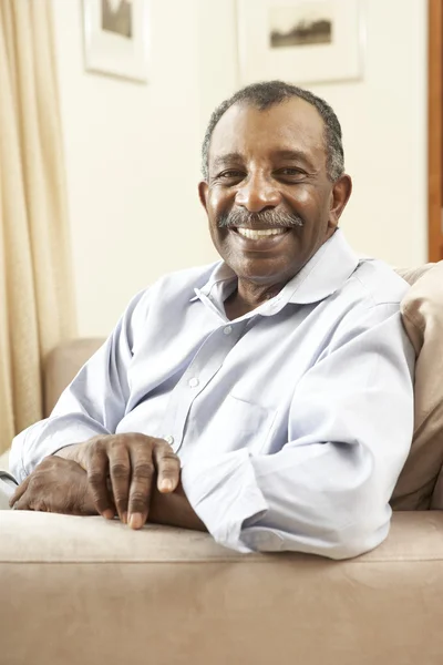 Senior Man Relaxing In Chair At Home — Stock Photo, Image