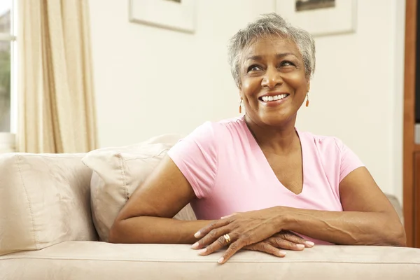 Senior Woman Relaxing In Chair At Home — Stock Photo, Image