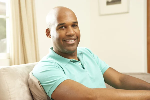 Man Relaxing On Sofa At Home — Stock Photo, Image