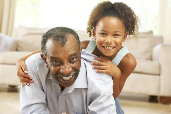 Grandfather And Granddaughter Playing Together At Home — Stock Photo, Image