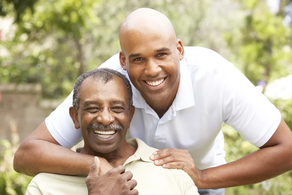 Senior Man Hugging Adult Son — Stock Photo, Image