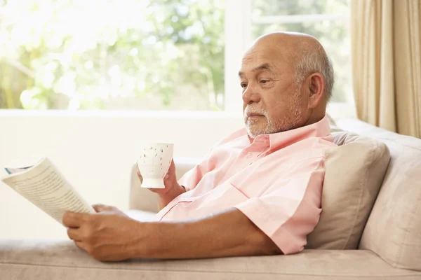 Senior Man Reading Book Drink Home — Stock Photo, Image