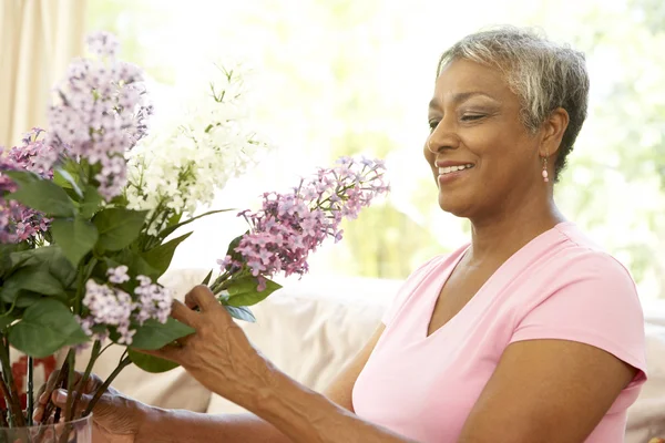 Senior Woman Flower Arranging Home Royalty Free Stock Photos