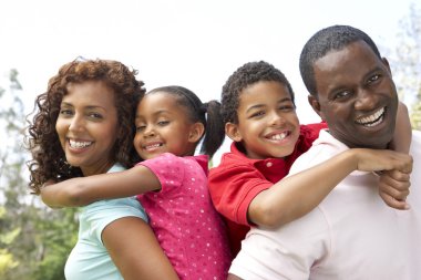 Portrait of Happy Family In Park clipart