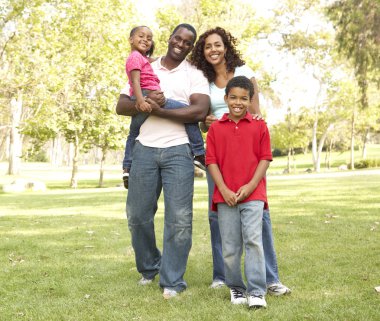 Family Enjoying Walk In Park clipart